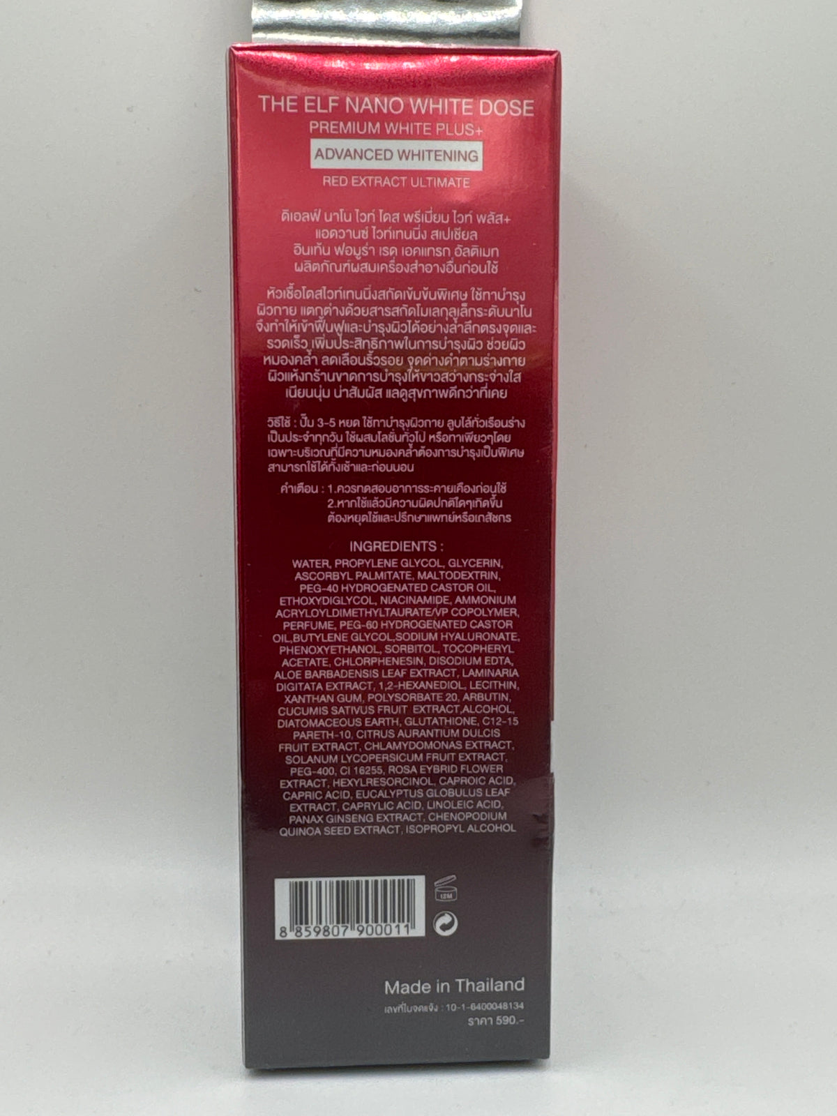 The Elf Nano White Dose back label showing Thai product information, ingredients, barcode, and Made in Thailand text.

