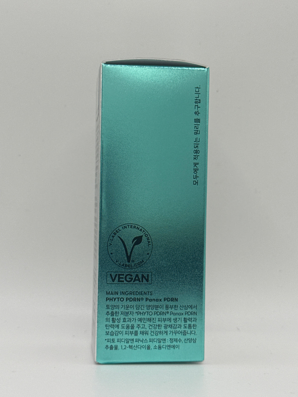 VT PDRN Essence 100 teal box side panel showing vegan certification and PHYTO PDRN Panax information.