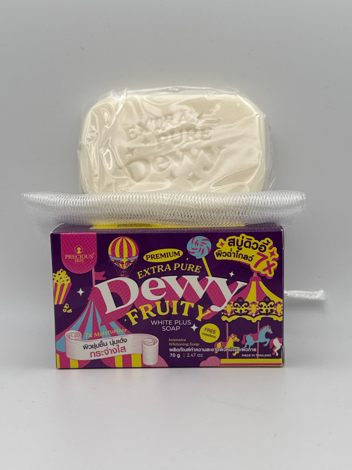 Soap and box: Wrapped Precious Skin Dewy Fruity soap bar with mesh foaming net above the product box.