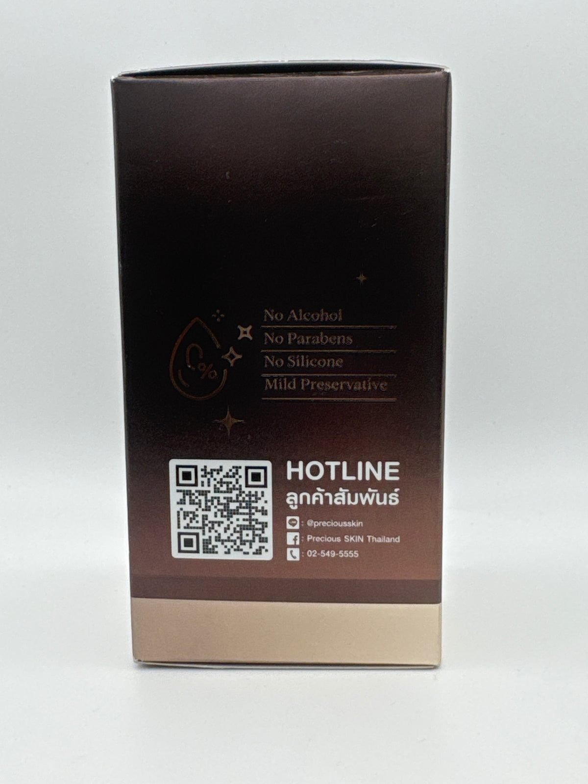 Product claims panel: Precious Skin Black Ginseng Serum side panel showing no alcohol, no parabens, and no silicone claims with a customer-service QR code.