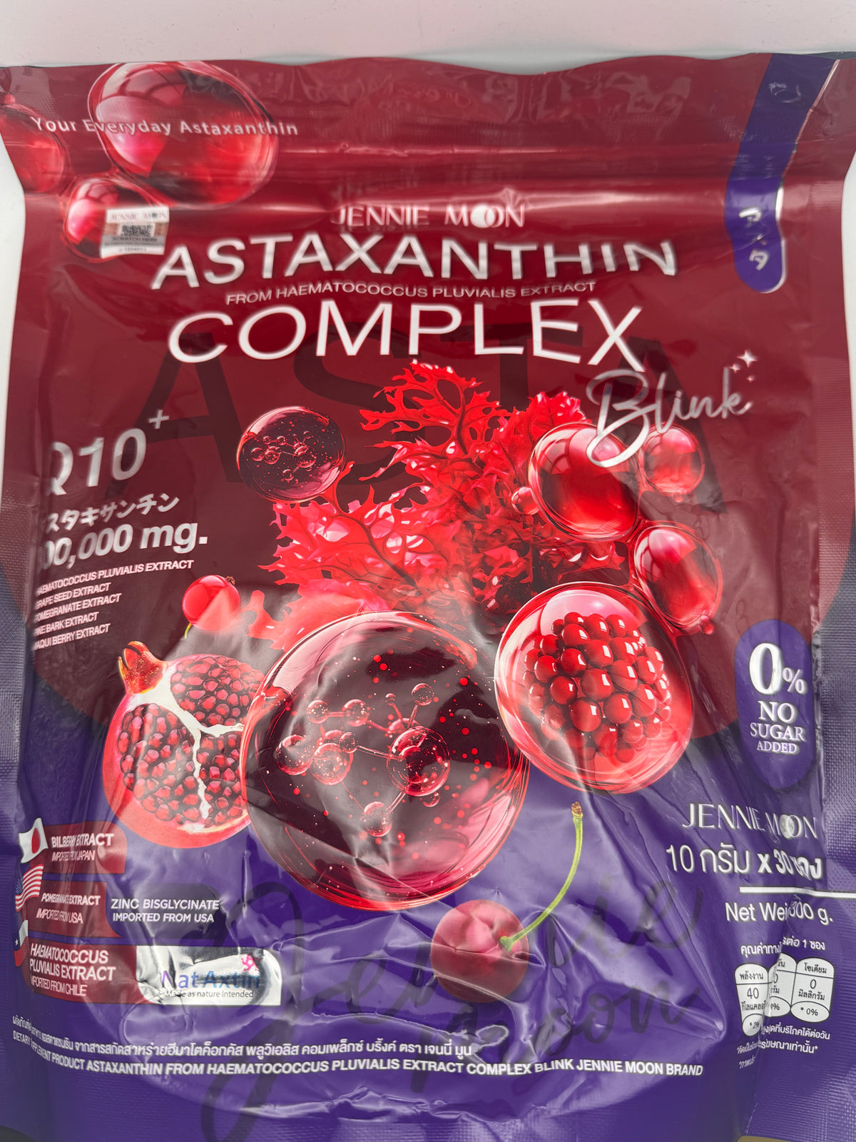 Dark red foil pouch of Jennie Moon Astaxanthin Complex Blink dietary supplement drink with Q10+, no sugar added, 30 sachets, with pomegranate and berry artwork