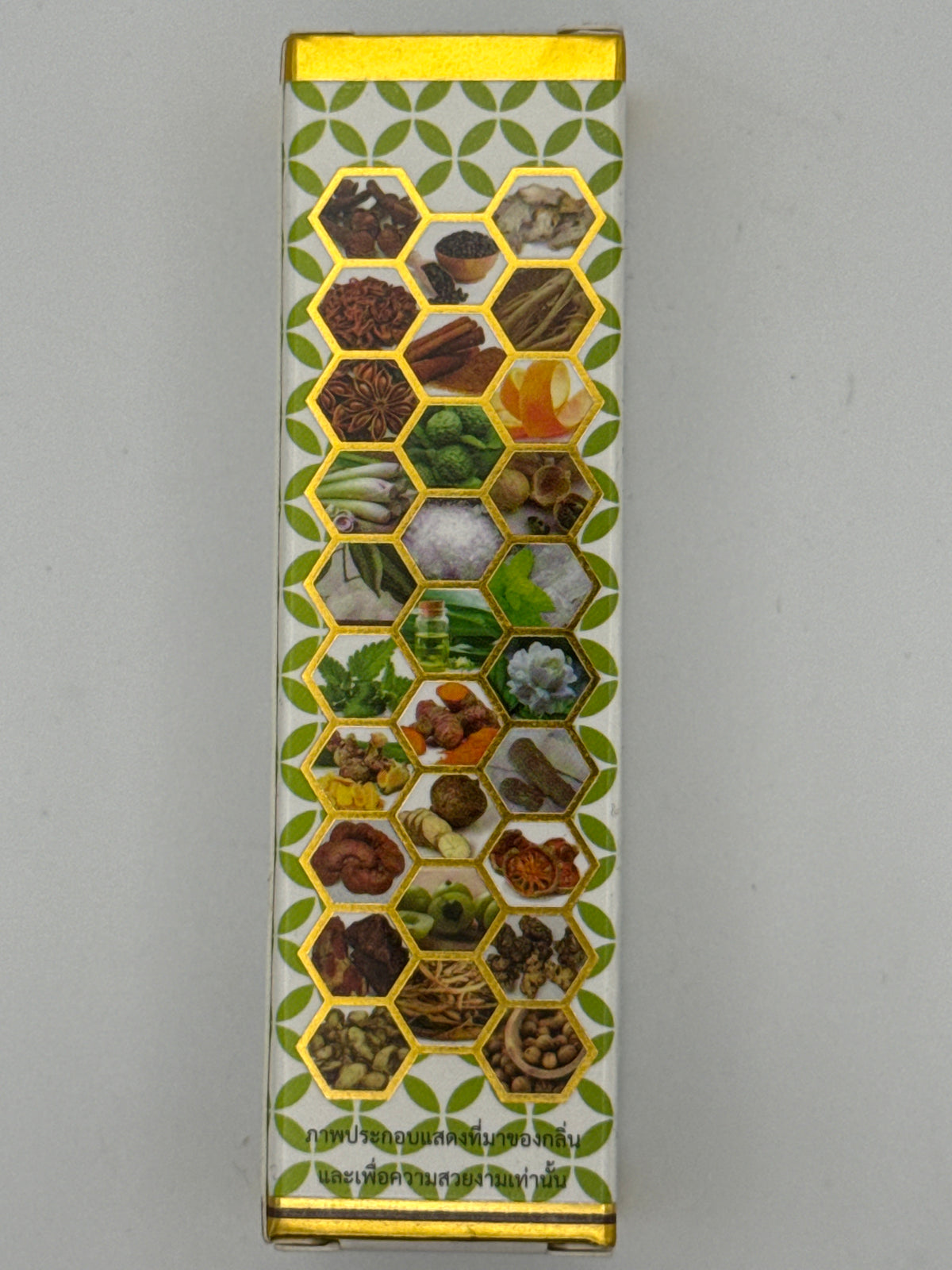Herbal imagery panel: Rakprai Body Massage Oil packaging with herb and botanical photos arranged in gold-bordered hexagons.