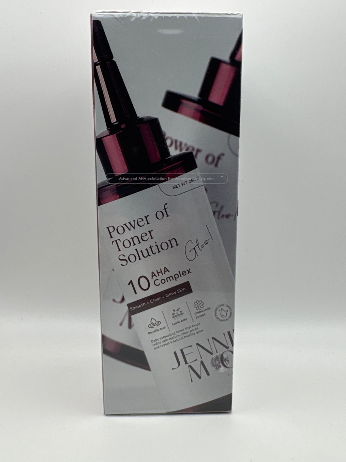 Side of Jennie Moon Power of Toner Solution box featuring burgundy pump bottle graphics.