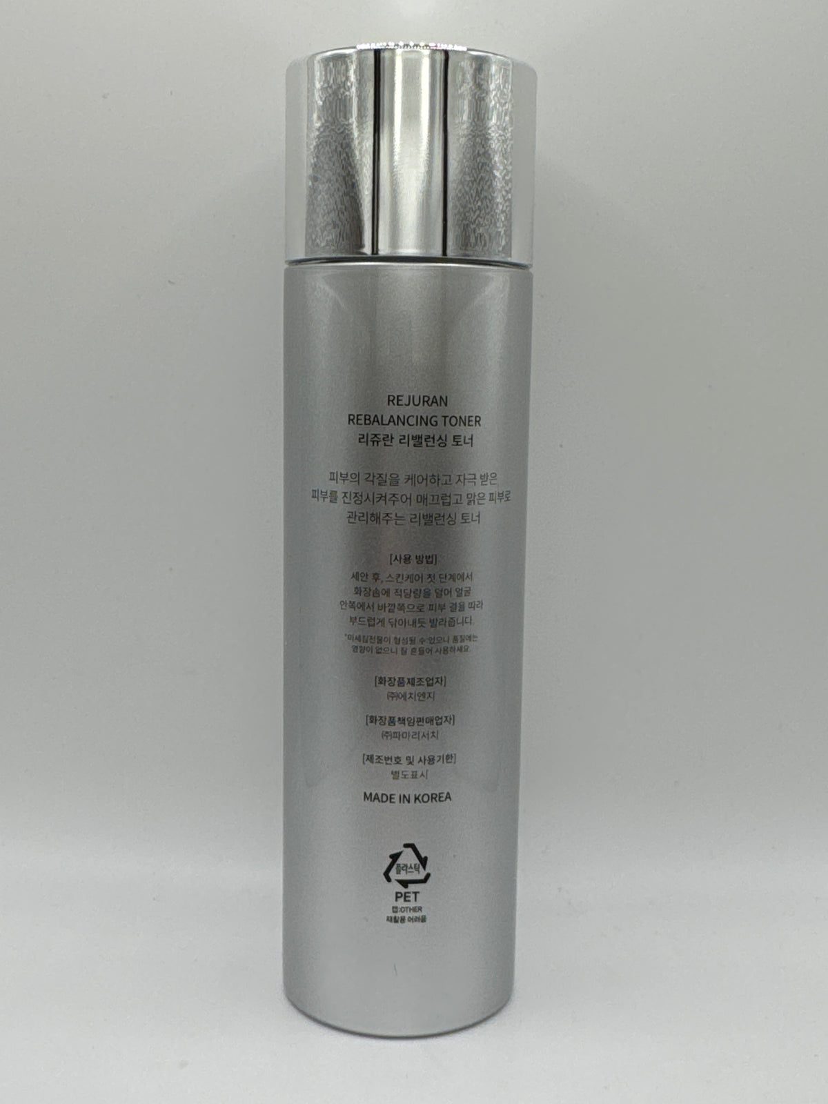 Rejuran Rebalancing Toner bottle, back view showing Korean product information and Made in Korea label.