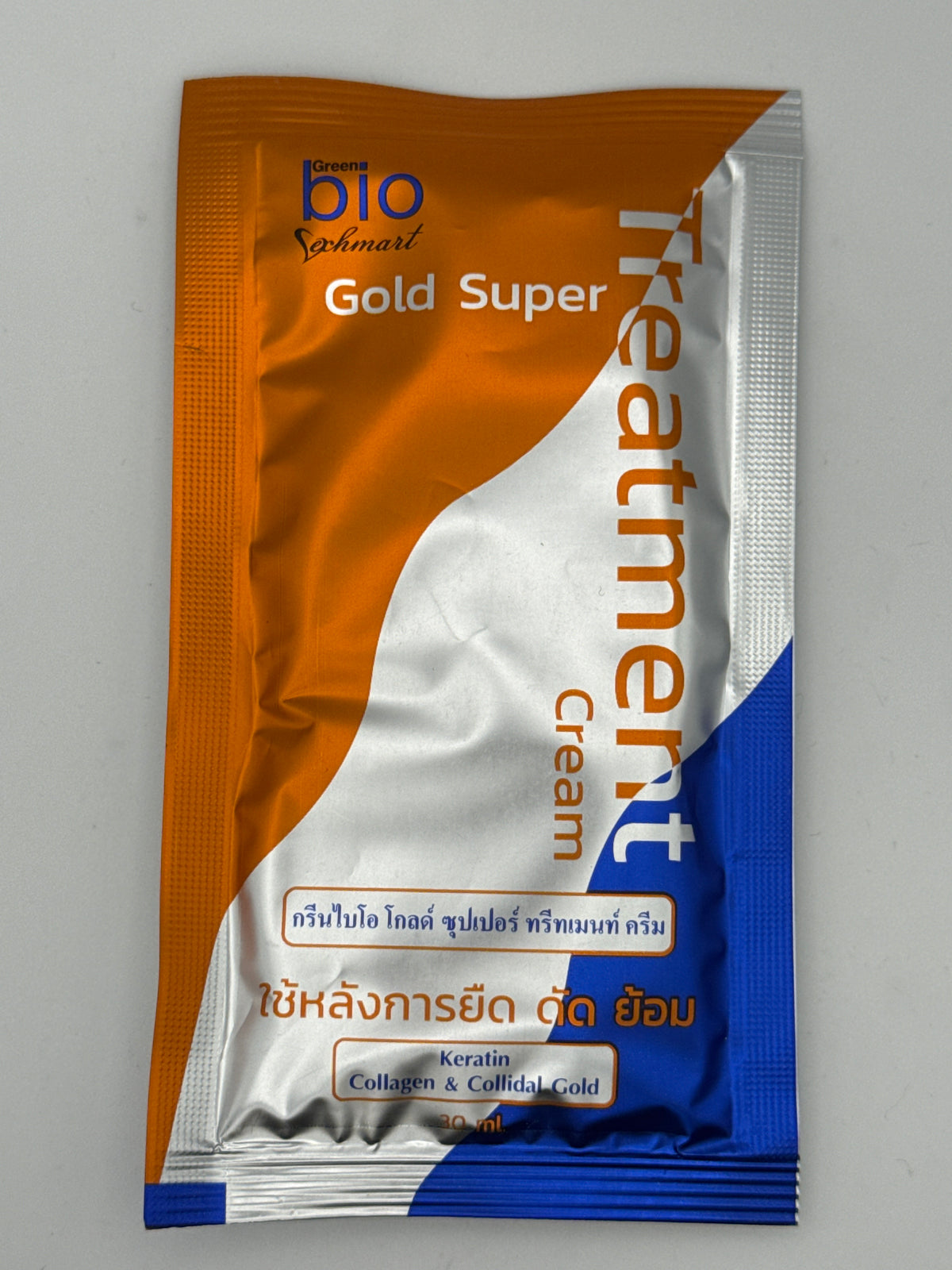 Bio Gold Super Hair Treatment Cream sachet with orange, silver, and blue packaging and keratin, collagen, and colloidal gold labeling.