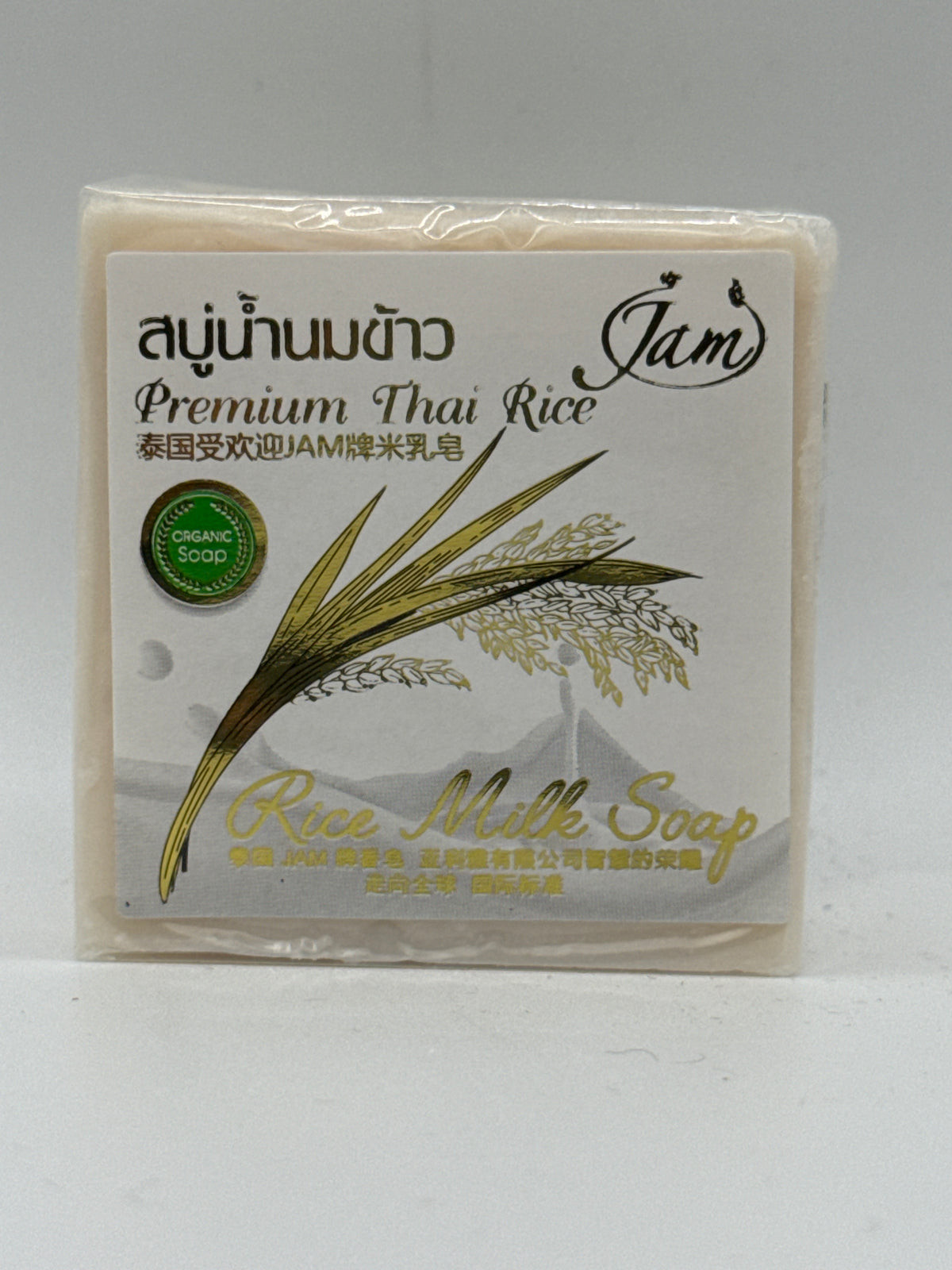 Jam Premium Thai Rice Milk Soap individual bar, front view with rice illustration and white-and-gold label.