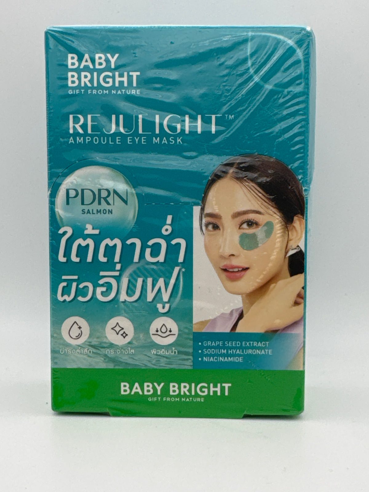 Front photo: Baby Bright Rejulight PDRN Ampoule Eye Mask teal box featuring salmon PDRN and a model wearing teal under-eye patches.