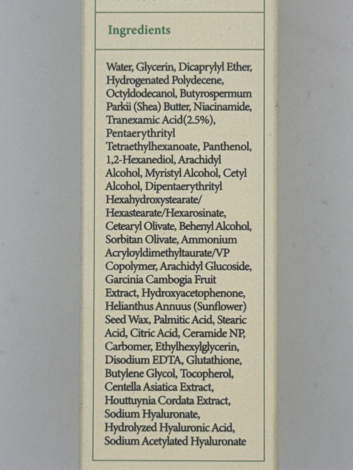 Korean label panel: AXIS-Y TXA 2.5% cream Korean label with glow care, moisturizing, and soothing icons and Made in Korea marking.