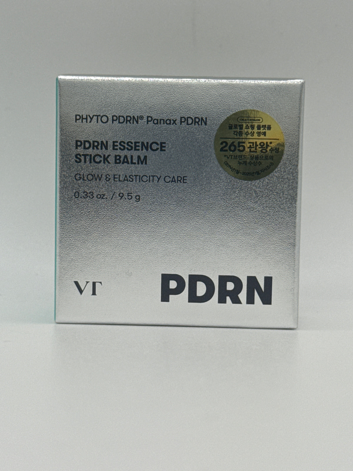 VT PDRN Essence Stick Balm 9.5 g silver box, front view showing PHYTO PDRN Panax PDRN and glow and elasticity care labeling.