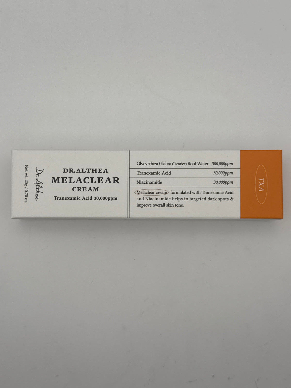 Front photo: Dr. Althea Melaclear Cream 20 g box showing tranexamic acid, niacinamide, and licorice root water concentrations.