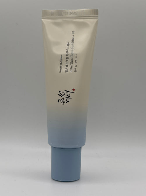 Beauty of Joseon Relief Sun Aqua Fresh Rice + B5 sunscreen tube with blue cap, front view.